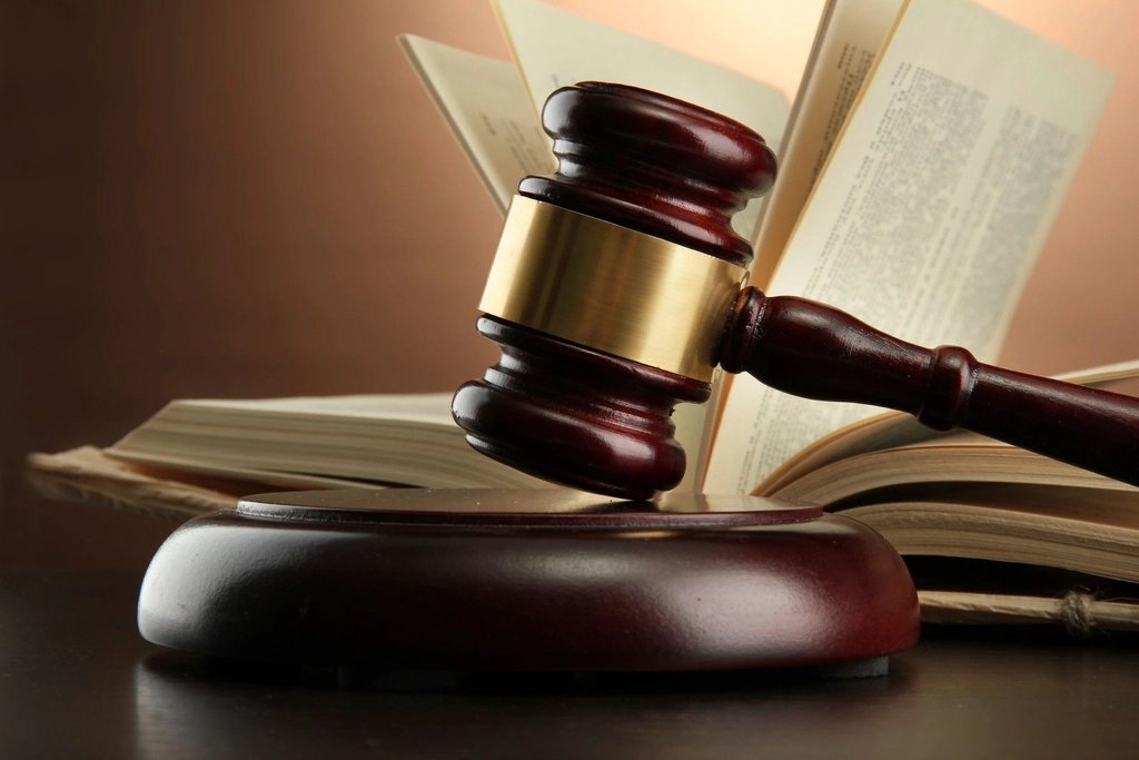 A gavel resting on a stack of law books