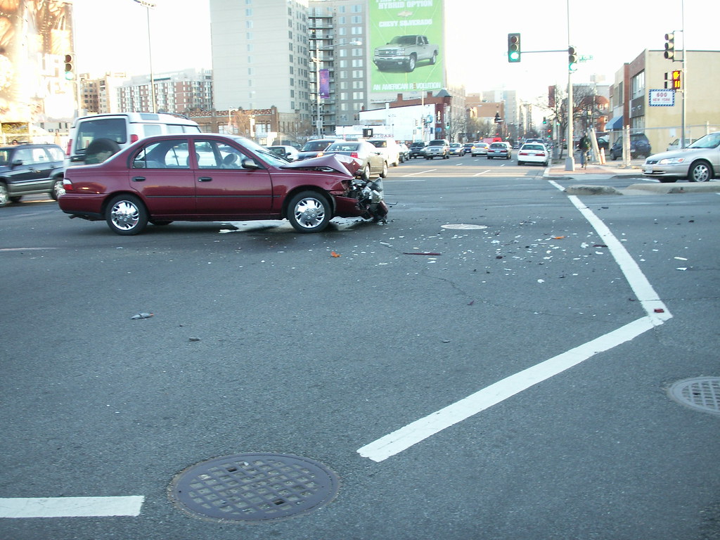 Intersection collision scene with debris on the road